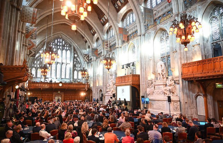 The Thinkers50 Awards Gala taking place at Guildhall in London, with guests seated at round tables and a speakers on stage.