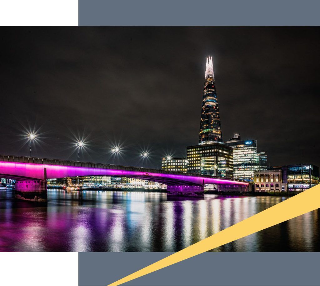 London Bridge and the lights of London in the night.